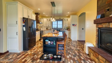 Welcome to this charming custom home on 1.11 acres with on Bell Nob Golf Course in Wyoming - for sale on GolfHomes.com, golf home, golf lot