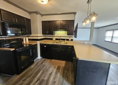 Enjoy the beautiful open views from this 3 bedroom, one and a on Coyote Creek Golf Club in Indiana - for sale on GolfHomes.com, golf home, golf lot