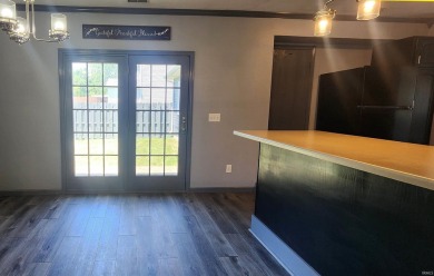 Enjoy the beautiful open views from this 3 bedroom, one and a on Coyote Creek Golf Club in Indiana - for sale on GolfHomes.com, golf home, golf lot