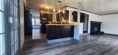 Enjoy the beautiful open views from this 3 bedroom, one and a on Coyote Creek Golf Club in Indiana - for sale on GolfHomes.com, golf home, golf lot
