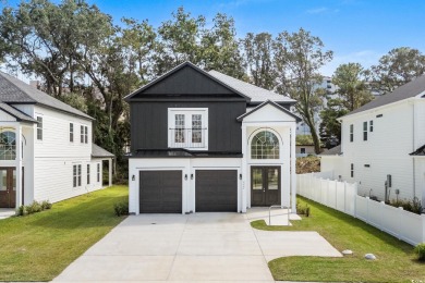 Welcome to this luxurious 4-bedroom, 3.5-bath beach home! on Whispering Pines in South Carolina - for sale on GolfHomes.com, golf home, golf lot