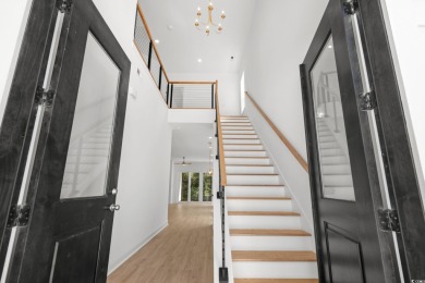 Welcome to this luxurious 4-bedroom, 3.5-bath beach home! on Whispering Pines in South Carolina - for sale on GolfHomes.com, golf home, golf lot