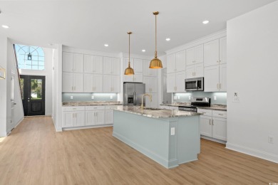 Welcome to this luxurious 4-bedroom, 3.5-bath beach home! on Whispering Pines in South Carolina - for sale on GolfHomes.com, golf home, golf lot