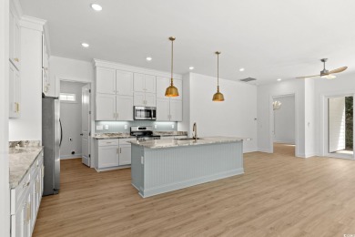 Welcome to this luxurious 4-bedroom, 3.5-bath beach home! on Whispering Pines in South Carolina - for sale on GolfHomes.com, golf home, golf lot