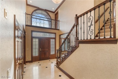 Welcome to this breathtaking brick estate, perfectly positioned on Glenmoor Country Club in Ohio - for sale on GolfHomes.com, golf home, golf lot