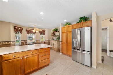 BOND PAID!! WELCOME TO THIS DESIGNER CYPRESS MODEL HOME IN THE on The Links of Spruce Creek in Florida - for sale on GolfHomes.com, golf home, golf lot