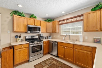 BOND PAID!! WELCOME TO THIS DESIGNER CYPRESS MODEL HOME IN THE on The Links of Spruce Creek in Florida - for sale on GolfHomes.com, golf home, golf lot