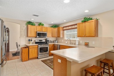 BOND PAID!! WELCOME TO THIS DESIGNER CYPRESS MODEL HOME IN THE on The Links of Spruce Creek in Florida - for sale on GolfHomes.com, golf home, golf lot