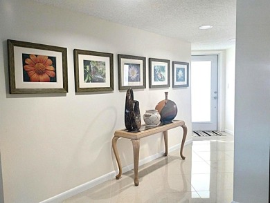 BRIGHT AND AIRY, EXTRA LARGE 1346 SQ/FT RENOVATED CORNER on Wynmoor Golf Course in Florida - for sale on GolfHomes.com, golf home, golf lot