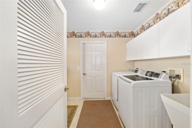 BOND PAID!! WELCOME TO THIS DESIGNER CYPRESS MODEL HOME IN THE on The Links of Spruce Creek in Florida - for sale on GolfHomes.com, golf home, golf lot