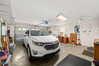 BOND PAID!! WELCOME TO THIS DESIGNER CYPRESS MODEL HOME IN THE on The Links of Spruce Creek in Florida - for sale on GolfHomes.com, golf home, golf lot