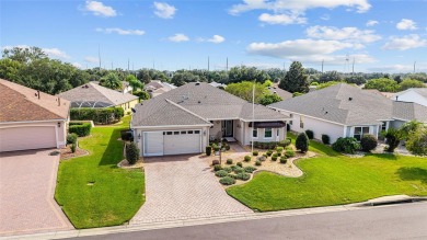 BOND PAID!! WELCOME TO THIS DESIGNER CYPRESS MODEL HOME IN THE on The Links of Spruce Creek in Florida - for sale on GolfHomes.com, golf home, golf lot