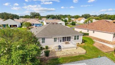 BOND PAID!! WELCOME TO THIS DESIGNER CYPRESS MODEL HOME IN THE on The Links of Spruce Creek in Florida - for sale on GolfHomes.com, golf home, golf lot
