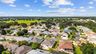 BOND PAID!! WELCOME TO THIS DESIGNER CYPRESS MODEL HOME IN THE on The Links of Spruce Creek in Florida - for sale on GolfHomes.com, golf home, golf lot