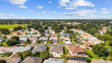 BOND PAID!! WELCOME TO THIS DESIGNER CYPRESS MODEL HOME IN THE on The Links of Spruce Creek in Florida - for sale on GolfHomes.com, golf home, golf lot
