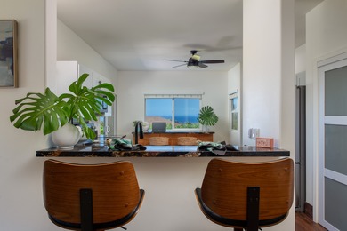 With sweeping 180-degree ocean views and a backdrop of 5 on Waikoloa Village Golf Club in Hawaii - for sale on GolfHomes.com, golf home, golf lot