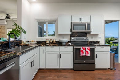 With sweeping 180-degree ocean views and a backdrop of 5 on Waikoloa Village Golf Club in Hawaii - for sale on GolfHomes.com, golf home, golf lot