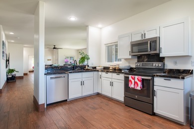 With sweeping 180-degree ocean views and a backdrop of 5 on Waikoloa Village Golf Club in Hawaii - for sale on GolfHomes.com, golf home, golf lot