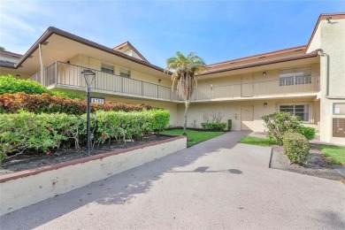 Beautifully renovated 3-bedroom, 2-bathroom corner unit in Holly on Woodmont Country Club in Florida - for sale on GolfHomes.com, golf home, golf lot