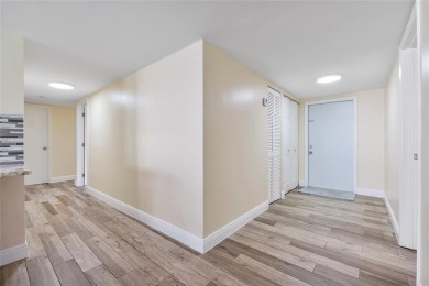 Beautifully renovated 3-bedroom, 2-bathroom corner unit in Holly on Woodmont Country Club in Florida - for sale on GolfHomes.com, golf home, golf lot
