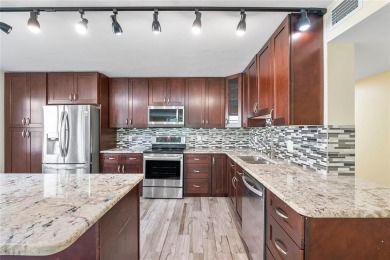 Beautifully renovated 3-bedroom, 2-bathroom corner unit in Holly on Woodmont Country Club in Florida - for sale on GolfHomes.com, golf home, golf lot