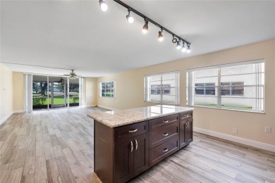 Beautifully renovated 3-bedroom, 2-bathroom corner unit in Holly on Woodmont Country Club in Florida - for sale on GolfHomes.com, golf home, golf lot