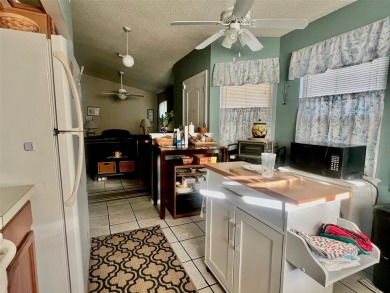 House with a lake in the backyard in a prime location right in on Mayfair Country Club in Florida - for sale on GolfHomes.com, golf home, golf lot