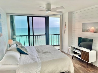 Welcome to your coastal retreat! This beautifully furnished on Island Dunes Country Club in Florida - for sale on GolfHomes.com, golf home, golf lot