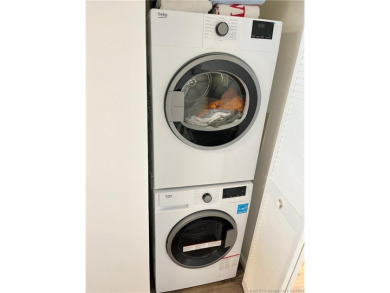 Welcome to your coastal retreat! This beautifully furnished on Island Dunes Country Club in Florida - for sale on GolfHomes.com, golf home, golf lot