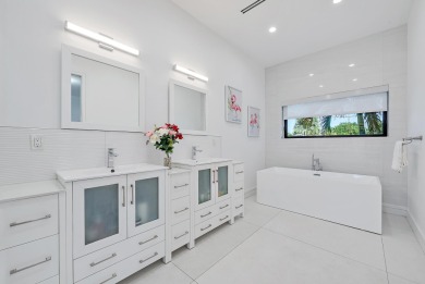 Welcome to a beautiful, newly built, modern home on one of Lake on Lake Worth Municipal Golf Course in Florida - for sale on GolfHomes.com, golf home, golf lot