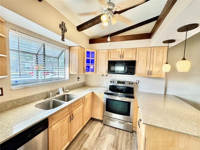 Welcome to this inviting home in Fairway Villas, offering 2 on Sabal Trace Golf and Country Club in Florida - for sale on GolfHomes.com, golf home, golf lot