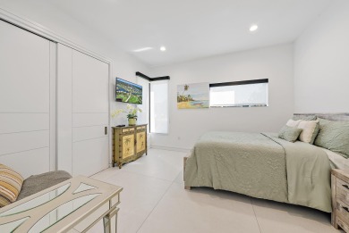 Welcome to a beautiful, newly built, modern home on one of Lake on Lake Worth Municipal Golf Course in Florida - for sale on GolfHomes.com, golf home, golf lot
