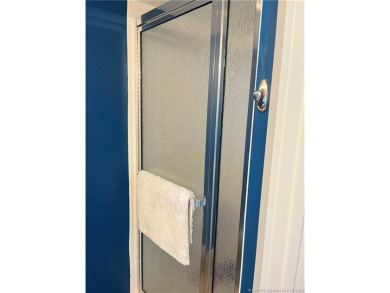 Welcome to your coastal retreat! This beautifully furnished on Island Dunes Country Club in Florida - for sale on GolfHomes.com, golf home, golf lot