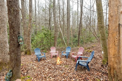 Enjoy a private 0.75-acre setting with the year-round sounds of on Sapphire National Golf Club in North Carolina - for sale on GolfHomes.com, golf home, golf lot