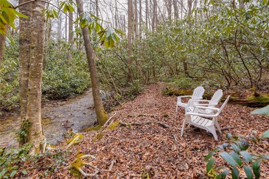 Enjoy a private 0.75-acre setting with the year-round sounds of on Sapphire National Golf Club in North Carolina - for sale on GolfHomes.com, golf home, golf lot