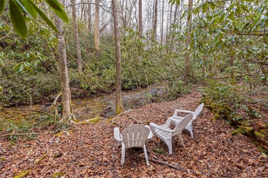 Enjoy a private 0.75-acre setting with the year-round sounds of on Sapphire National Golf Club in North Carolina - for sale on GolfHomes.com, golf home, golf lot