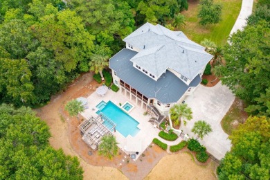 As you step into this elegant home, you'll be greeted by a on Dunes West Golf Club in South Carolina - for sale on GolfHomes.com, golf home, golf lot