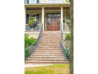 As you step into this elegant home, you'll be greeted by a on Dunes West Golf Club in South Carolina - for sale on GolfHomes.com, golf home, golf lot