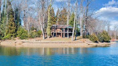 Million-dollar lake and mountain views define this on Waters Edge Country Club in Virginia - for sale on GolfHomes.com, golf home, golf lot