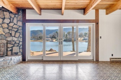 Million-dollar lake and mountain views define this on Waters Edge Country Club in Virginia - for sale on GolfHomes.com, golf home, golf lot