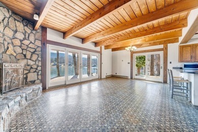 Million-dollar lake and mountain views define this on Waters Edge Country Club in Virginia - for sale on GolfHomes.com, golf home, golf lot