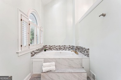 Tucked in Atlanta Country Club's quiet interior, this refreshed on Atlanta Country Club in Georgia - for sale on GolfHomes.com, golf home, golf lot