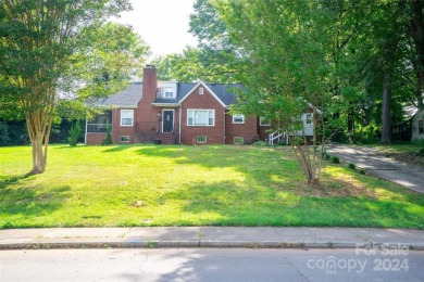 Discover this charming brick home in Revolution Park, minutes on Carolina Golf Club in North Carolina - for sale on GolfHomes.com, golf home, golf lot