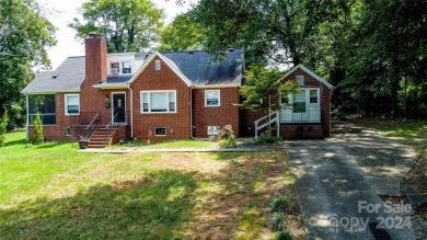 Discover this charming brick home in Revolution Park, minutes on Carolina Golf Club in North Carolina - for sale on GolfHomes.com, golf home, golf lot