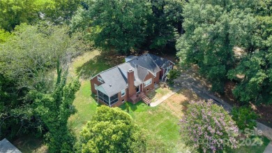 Discover this charming brick home in Revolution Park, minutes on Carolina Golf Club in North Carolina - for sale on GolfHomes.com, golf home, golf lot