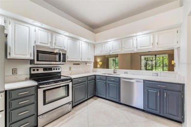 Welcome to this inviting FIRST FLOOR condo in the gated on East Lake Woodlands Country Club in Florida - for sale on GolfHomes.com, golf home, golf lot