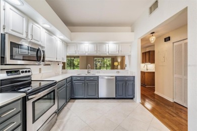 Welcome to this inviting FIRST FLOOR condo in the gated on East Lake Woodlands Country Club in Florida - for sale on GolfHomes.com, golf home, golf lot