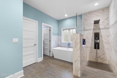 Welcome to this beautifully upgraded 4-bedroom, 3-bathroom home on Sea Trail Golf Resort in North Carolina - for sale on GolfHomes.com, golf home, golf lot