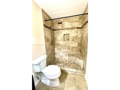 Discover this beautifully upgraded 2-bedroom, 2-bath corner unit on Pine Island Ridge Country Club in Florida - for sale on GolfHomes.com, golf home, golf lot
