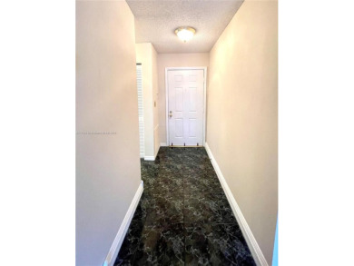 Discover this beautifully upgraded 2-bedroom, 2-bath corner unit on Pine Island Ridge Country Club in Florida - for sale on GolfHomes.com, golf home, golf lot